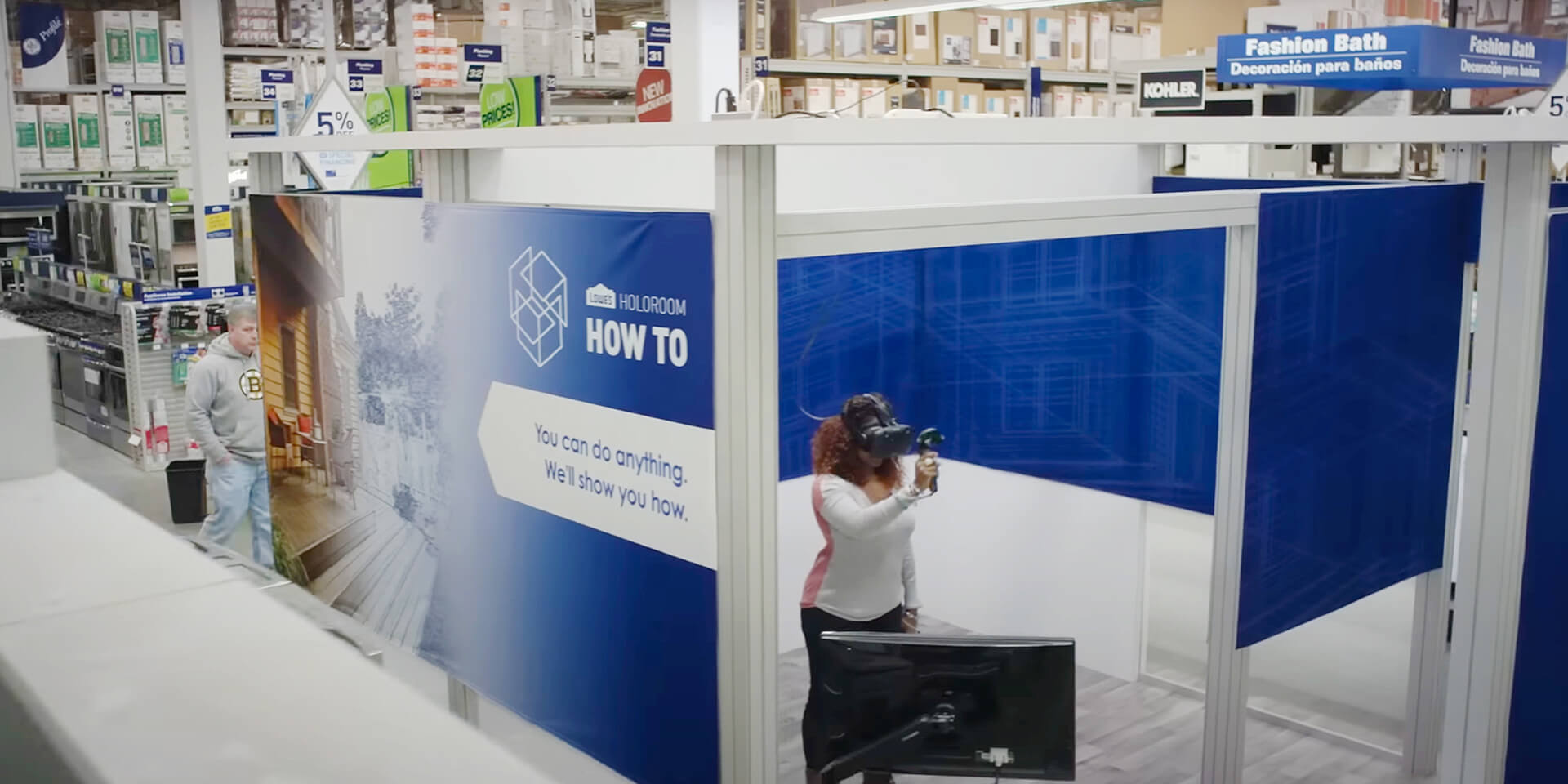 Lowe's Home Improvement holoroom experience with African-American female inside wearing VR headset learning DIY skills.