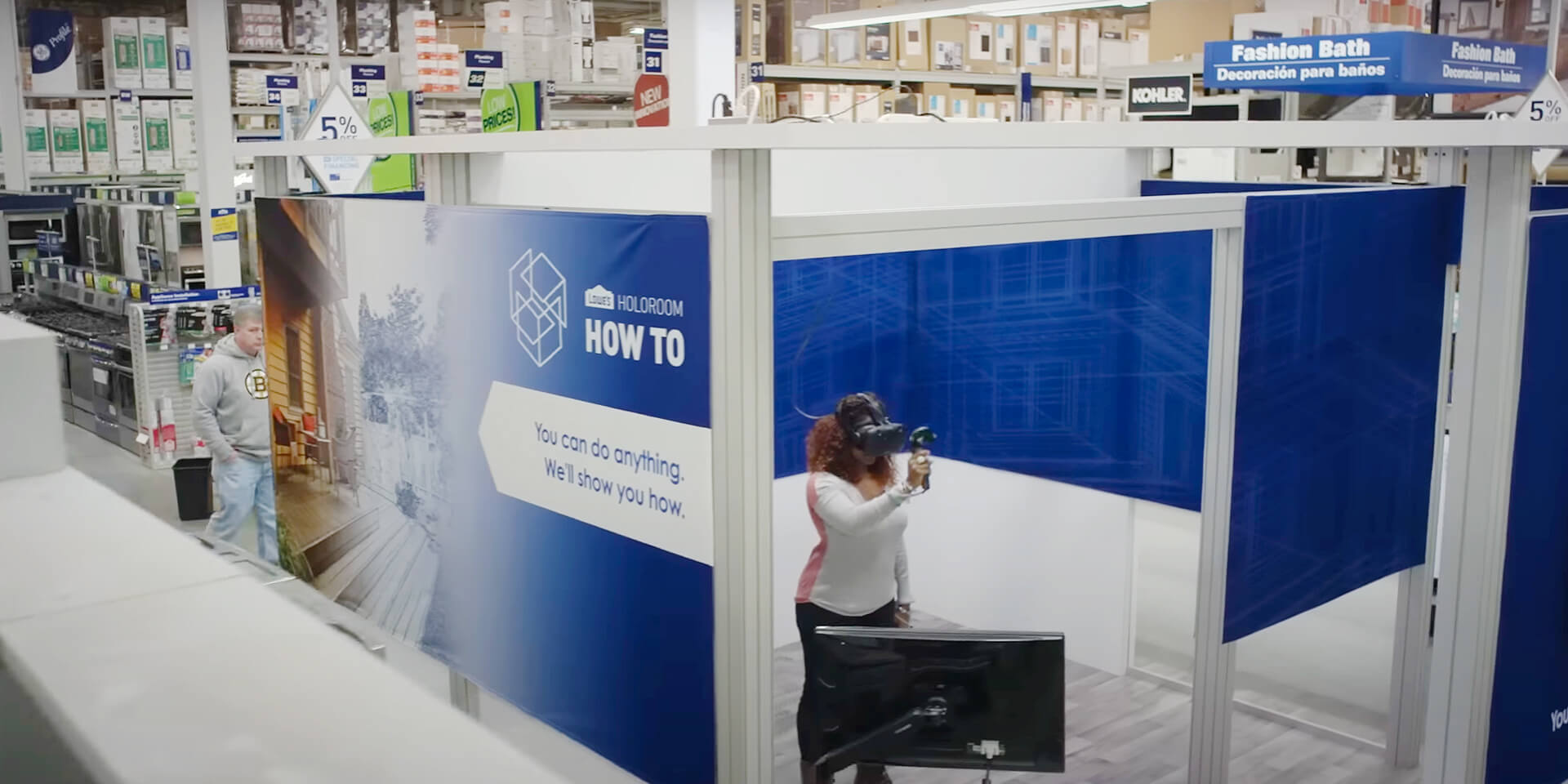 Lowe's Home Improvement holoroom experience with African-American female inside wearing VR headset learning DIY skills.
