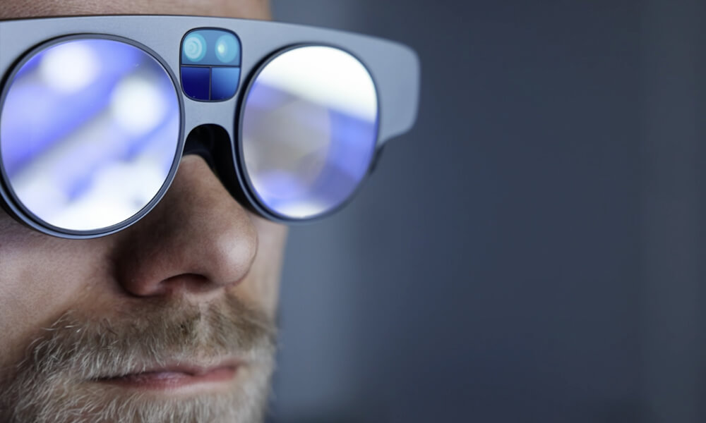 Closeup view of Lowes Home Improvement store associate wearing an AR headset used to assist in visualizing the Store Digital Twin in realtime.